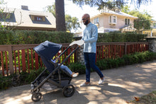 Load image into Gallery viewer, The UPPAbaby CRUZ V2 from Mega babies is easy to push, with all-round suspension.
