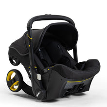 Load image into Gallery viewer, The Doona Car Seat &amp; Stroller - Midnight Edition from Mega babies features a one-motion fold.
